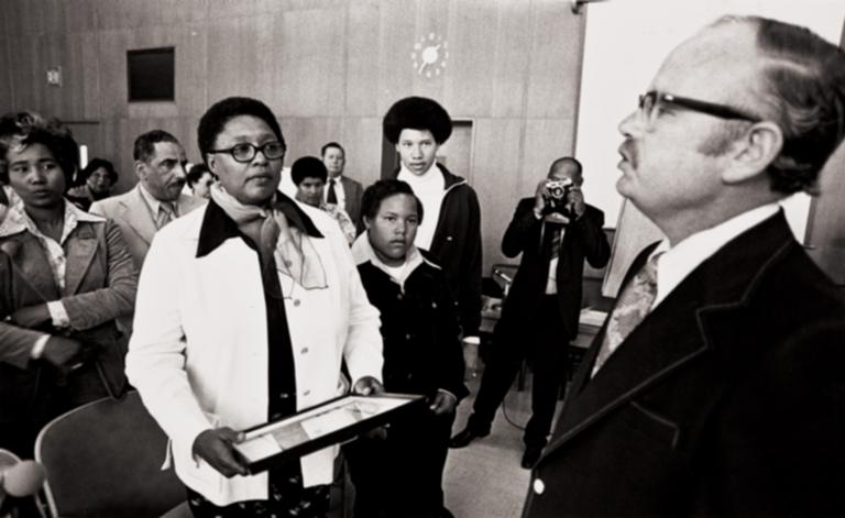 Mrs. Frances Tatum with her two sons receiving a proclamation : May 14, 1975 ; the proclamation from the Ventura County Board of Supervisors renamed Juvenile Hall, Clifton Tatum Center.